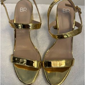 Metallic Gold Size 8 heel. Excellent condition. No scuffs